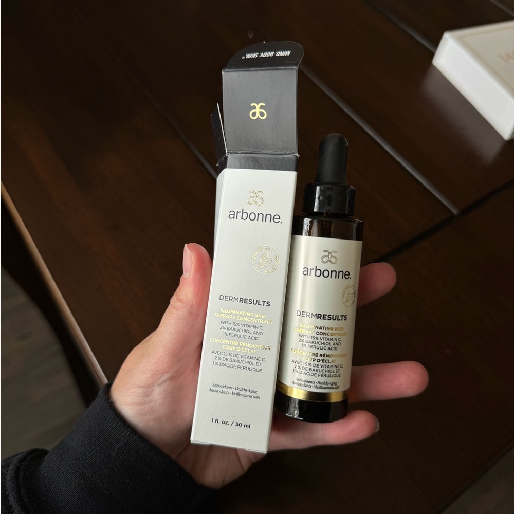 Arbonne DermResults Serum in Cream and Black Packaging